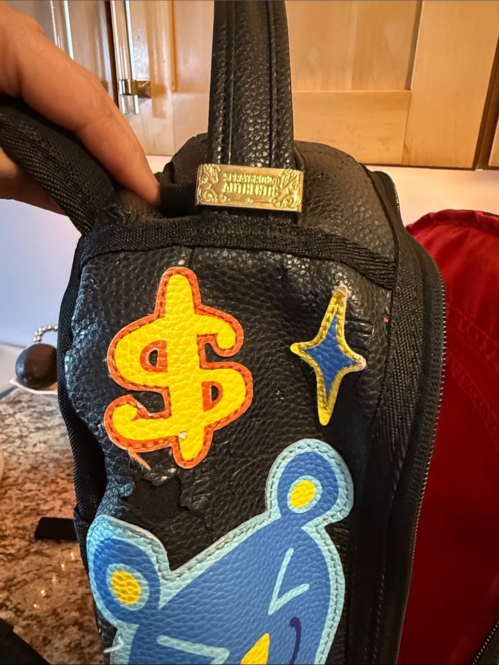 Sprayground Black Backpack with Neon Green Bear Patch and Multicolor Accents